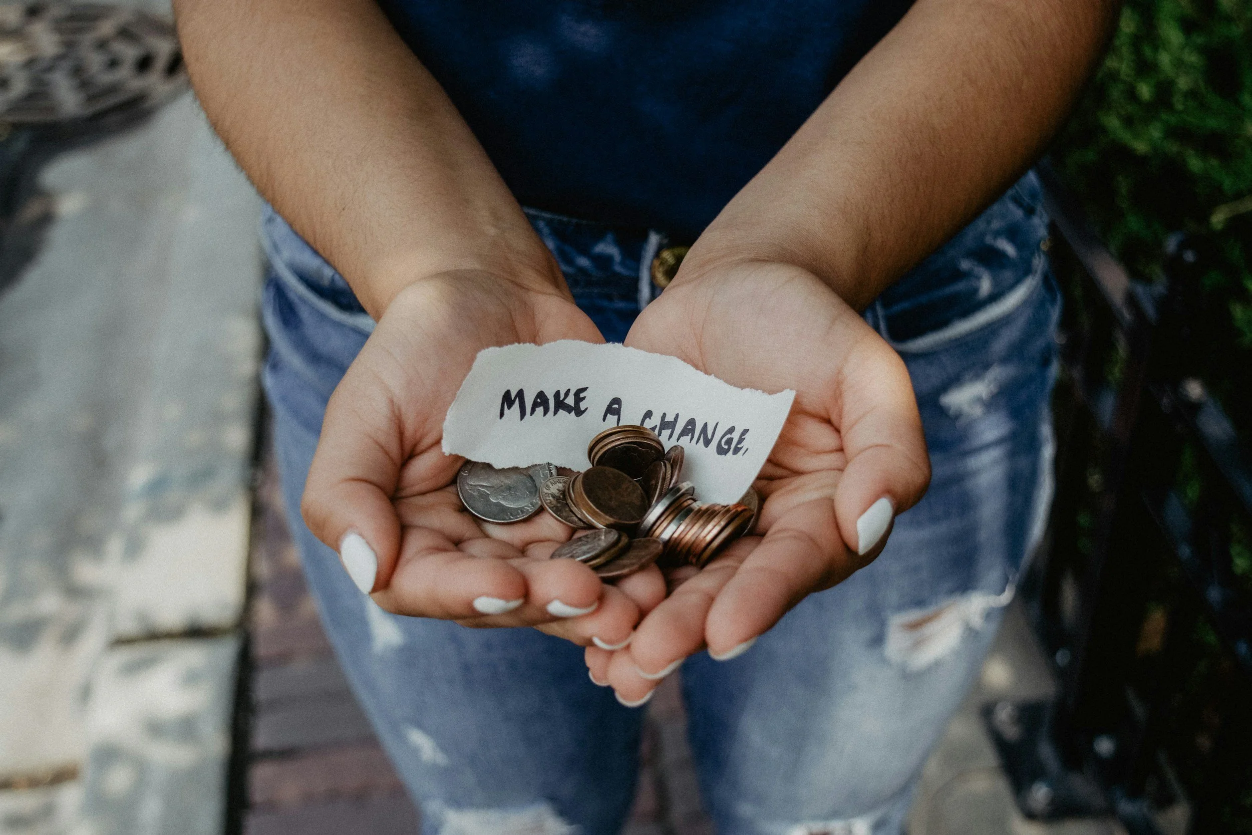 Hands holding coins — make a change